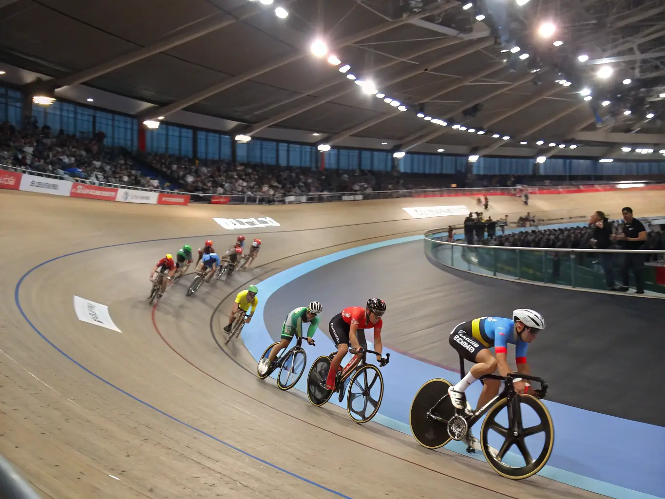 A dynamic shot of cyclists engaged in a competitive race, highlighting the intensity and skill involved in the ASSOCIATION SPORTIVE CULANAISE SECTION CYCLISTE's competitive cycling program.